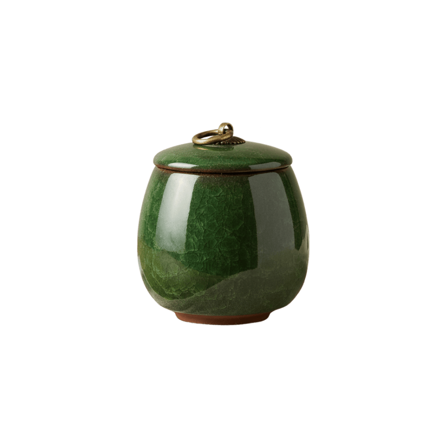 Donkergroene keramische urn met craquelé-effect en bronzen ring op de deksel, ronde vorm