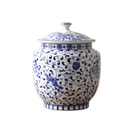 Witte keramische urn met blauw bloesemdecoratie, ronde vorm met deksel