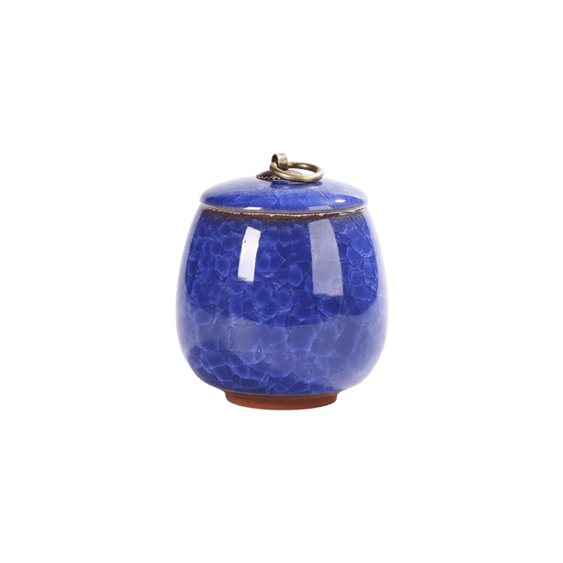 Keramische donkerblauwe urn met craquelépatroon en bronzen ring op de deksel, bolle vorm