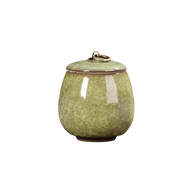 Lichtgroene keramische urn met craquelé-glazuur, ronde vorm, bronzen ring op de deksel