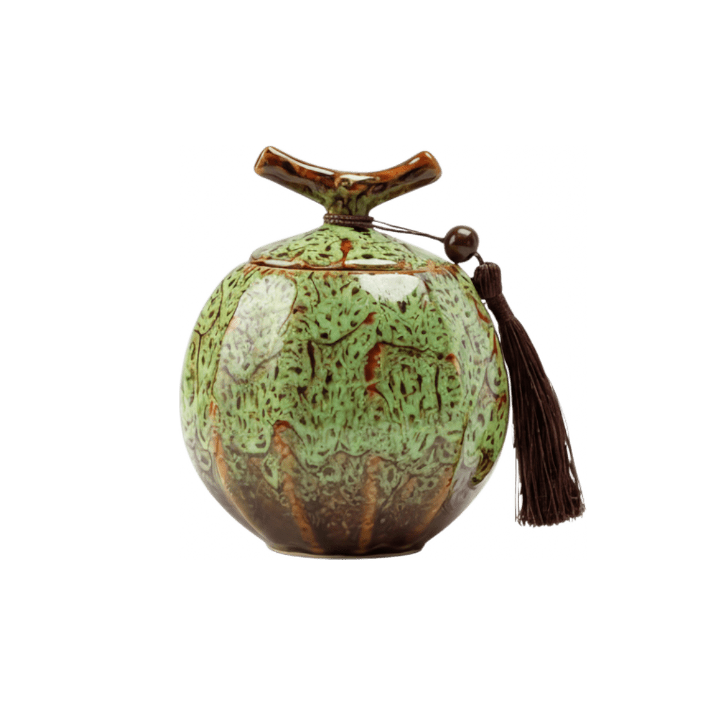 Keramische groene urn met bruine spikkels, ronde vorm, bruine kwast