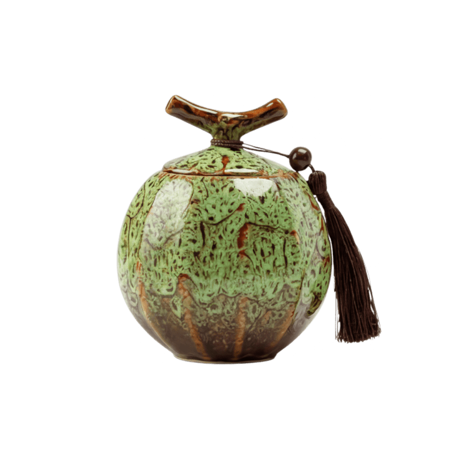 Keramische groene urn met bruine spikkels, ronde vorm, bruine kwast